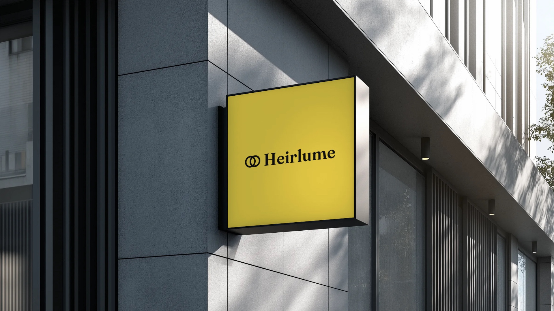 A yellow Heirlume blade sign on a gray building