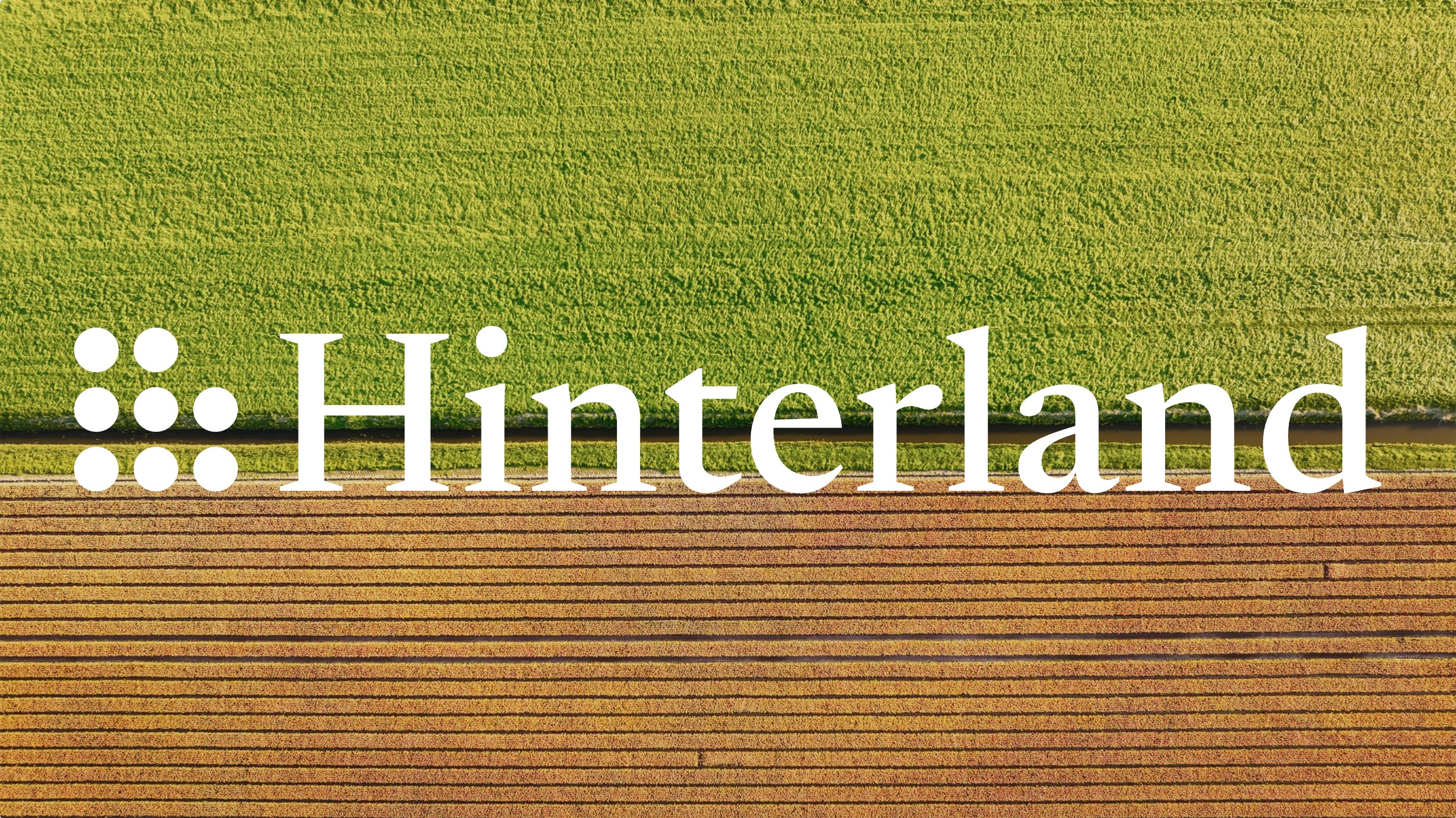 The Hinterland wordmark over farmland seen from above