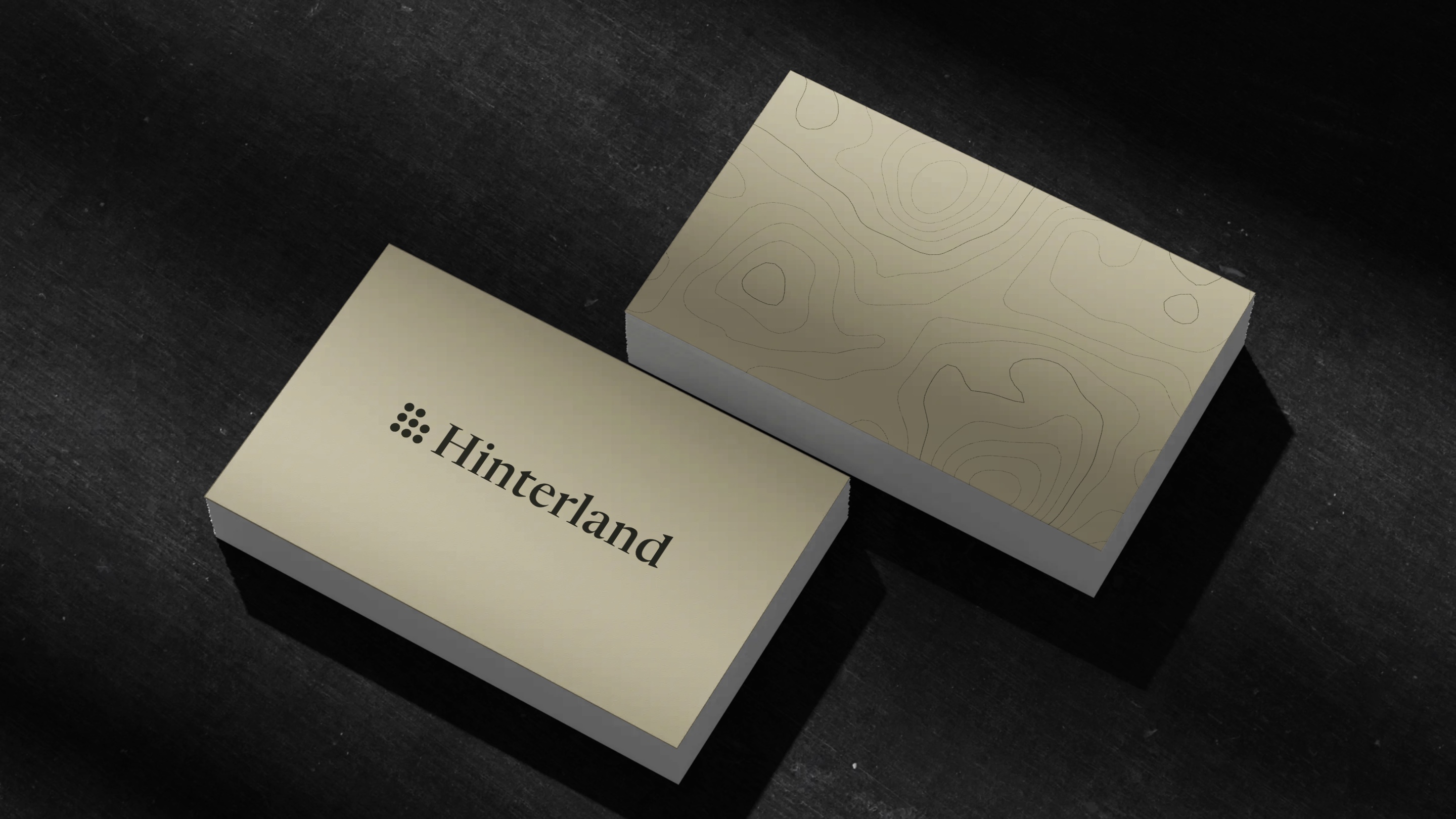 Business cards: the wordmark on khaki, the trail map on the back