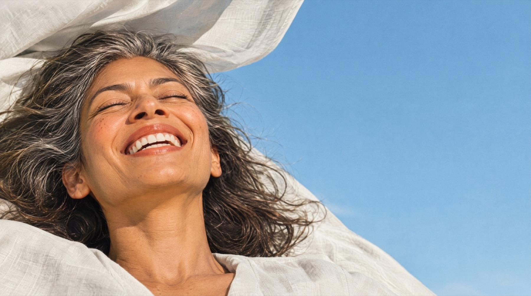 A patient laughing in the sun
